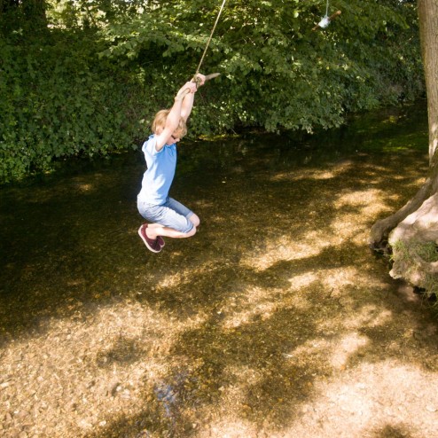Big Brother Swinging over the river